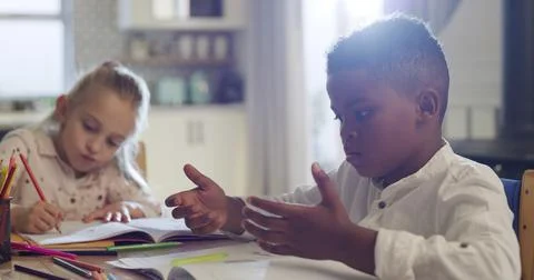 Boy, math and counting with book for problem solving, study or homework in Stock Photos