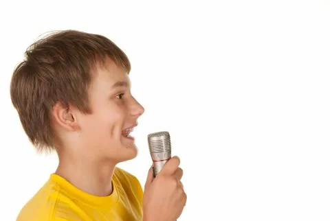 Boy with microphone on white Foto stock