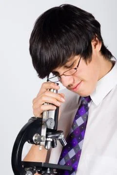 Boy with microscope Stock Photos