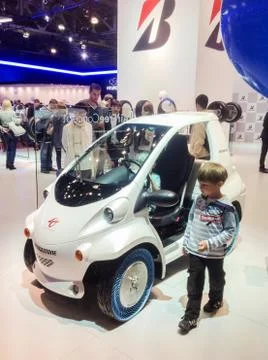 The boy at the minivan. Stock Photos