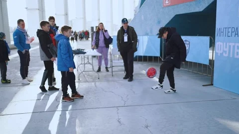 Boy minting a soccer ball 스톡 동영상 219417349