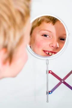 Boy in mirror Photos