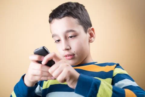 Boy with mobile phone Stock Photos