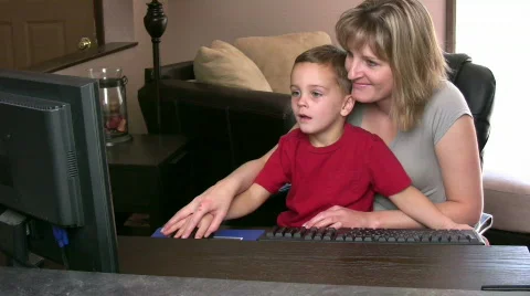 Boy in Moms Lap on Computer Stock Footage 522688