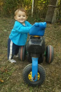 Boy on a motorcycle Stock Photos