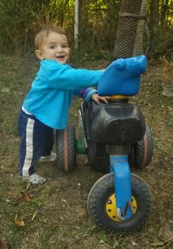 Boy on a motorcycle Stock Photos