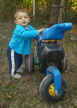 Boy on a motorcycle Stock Photos