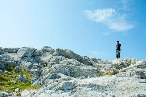 Boy on the Moutain Rocks Stock Photos