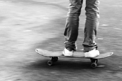 Boy on the move on the skateboard Stock Photos