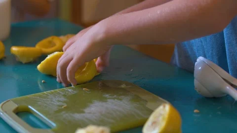 Boy Moving Squeezed Lemon Halves Stock Footage 94395984