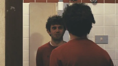 Boy Mugging at Mirror Video stock 87203734