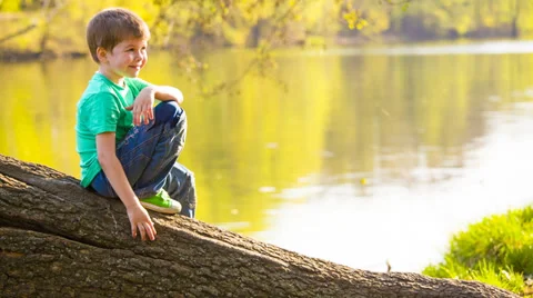 Boy near the water Stock Footage 37769578