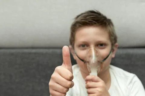 A boy with a nebulizer 1 Stock Photos