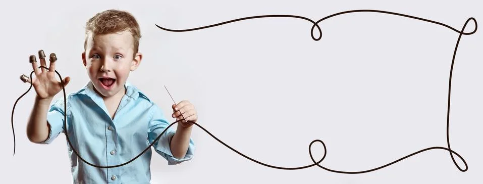 A boy with a needle and thread in a blue shirt on a light background Stock Photos