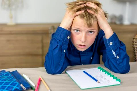 Boy needs help with his homework Stock Photos