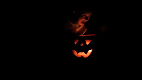 Boy at night with pumpkin Stock Footage 117339853