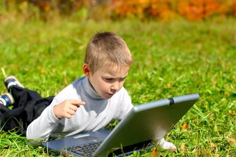 Boy with notebook Stock Photos