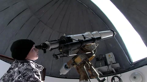 Boy from the observatory with a telescope watching Stock Footage 48217334