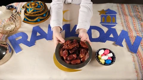 Boy offering medjools Stock Footage 173540338