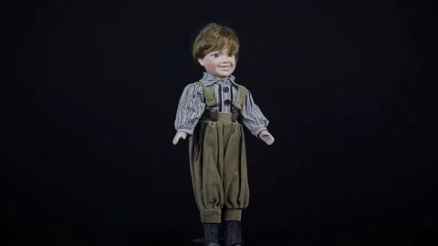 Boy Old Porcelain Big Doll On A Black Background. Stock Footage 220124448