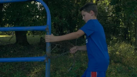 Boy opening cattle gate Video stock 96046109