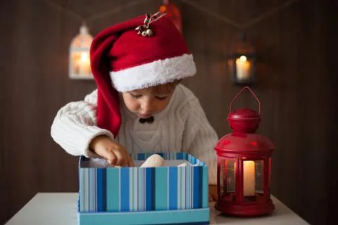 Boy, opening present Stock Photos