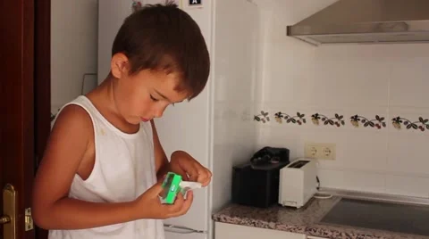 Boy opens a pack of gum Stock Footage 65300437