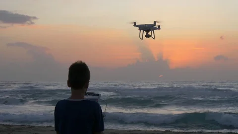 Boy operating a drone with remote control. Stock Footage 81944143