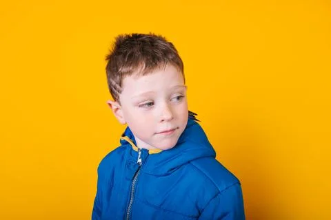 Boy in outerwear with parrot Foto stock