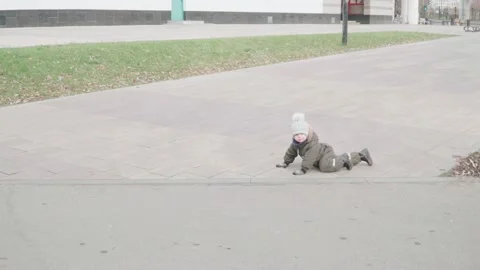 Boy in overalls falls Stock-Footage 144217418