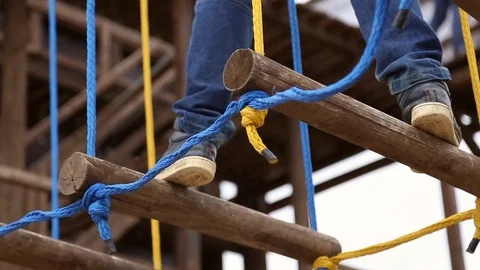 Boy overcomes a challenging obstacle Stock Footage 76777818