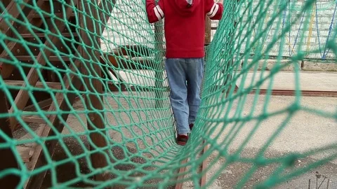 Boy overcomes a challenging obstacle Stock Footage 76778122