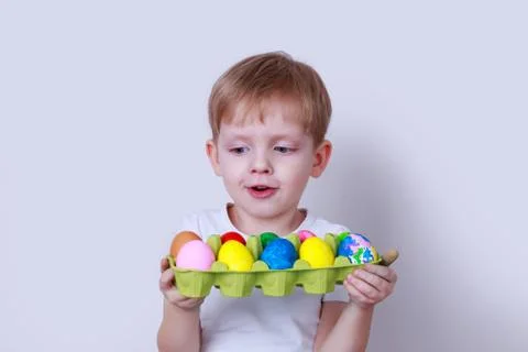 Boy with painted eggs Stock Photos