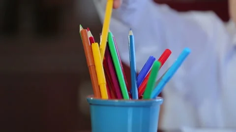 Boy paints with colored pencils Stock Footage 89402582