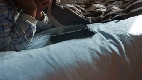 Boy in pajamas with a tablet Stock Footage 75614324