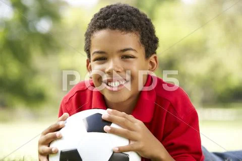 Boy In Park With Football Stock Photos