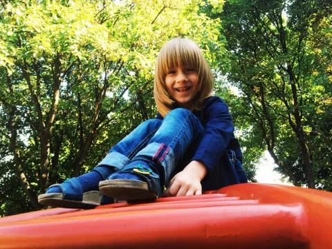 Boy in the park with trees Stock Photos