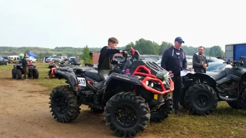 The boy parks the ATV is not safe without a helmet. Stock Footage 189048044