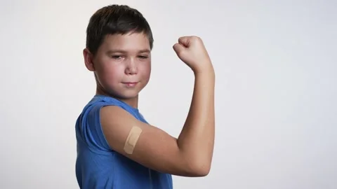 A boy with a patch on his shoulder. Vaccination concept Stock Footage 237670158