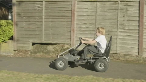 Boy on pedal kart Video stock 117348109
