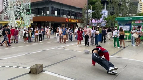 Boy performs breakdancing in Siam public square, Bangkok, Thailand 4K Stock Footage 202298573