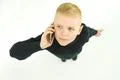 The boy phone on the white background. View from above Photo