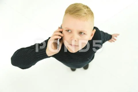 The boy phone on the white background. View from above Stock Photos