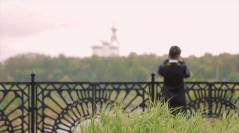 Boy Photographing Landscape From the Bridge Stock Footage 63395570