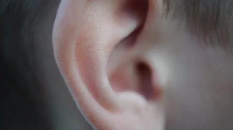 Boy picking his ear close up Видео 62329481