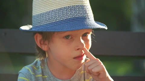Boy picking his nose Video stock 135022203