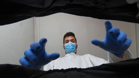 Boy picks up something from his backpack protected by gloves and mask Stock Footage 128827121