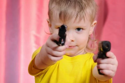 Boy with pistol Stock Photos