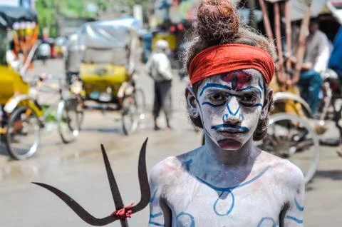 Boy with pitchfork in Assam Stock Photos
