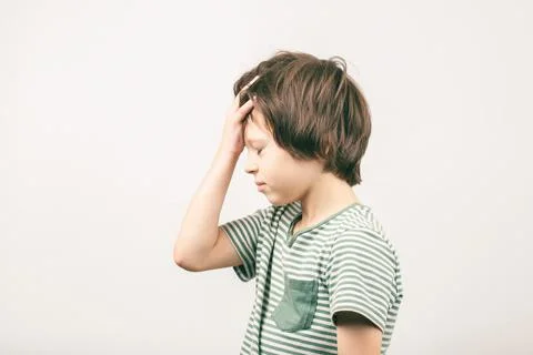 Boy placing hand on head. Face palm gesture Stock Photos
